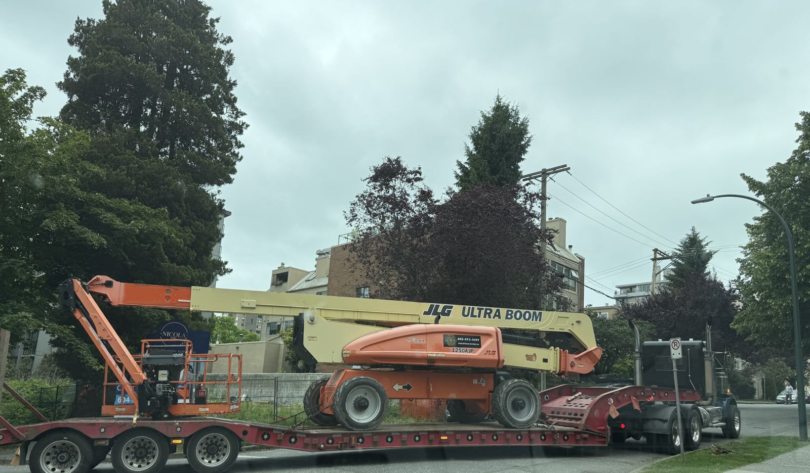 JLG boom lift on a lowbed for delivery